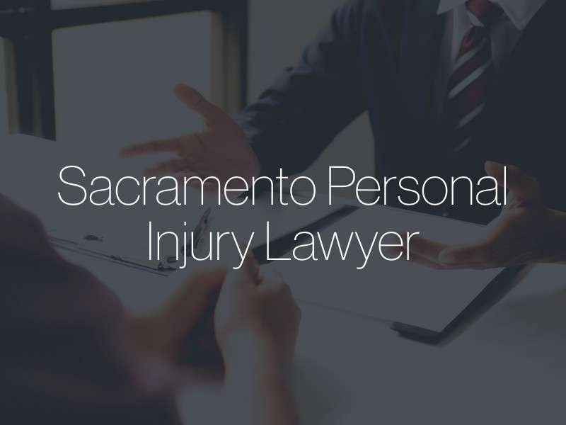 A lawyer speaking with a client with the text "Sacramento Personal Injury Lawyer" superimposed