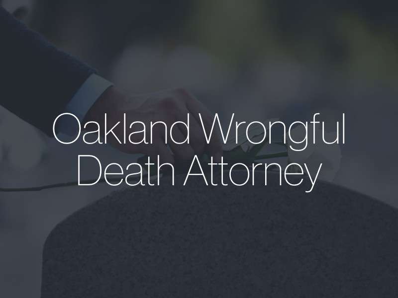 A hand placing flowers on a grave with the text "Oakland Wrongful Death Attorney" superimposed
